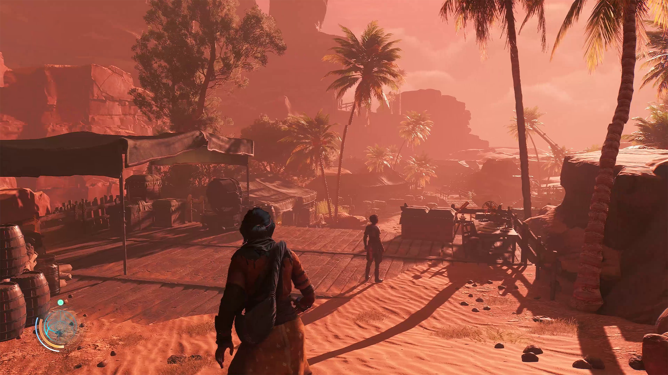 Haroona e Reika nel deserto si avvicinano a un accampamento degli Ascendenti nel videogioco Unknown 9: Awakening.